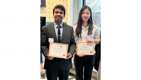 Liuyi Chang and Anto Charles holding MNIFT Awards